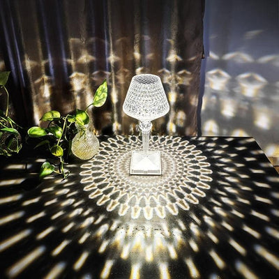 Crystal table lamp lit up, showing the full faceted acrylic body