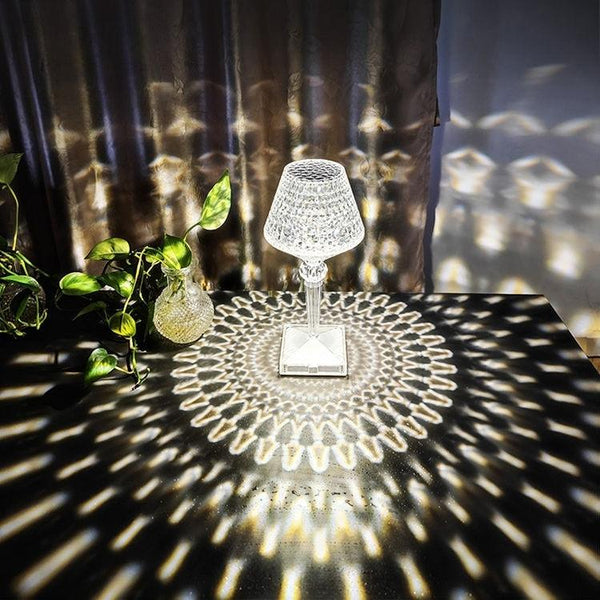 Crystal table lamp lit up, showing the full faceted acrylic body
