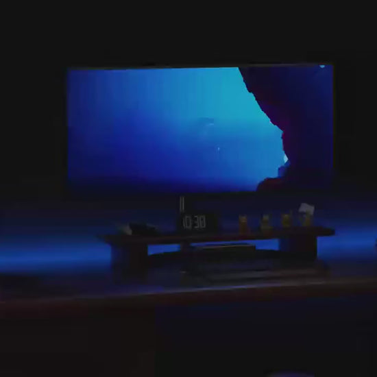 RGB light bars running colour and music-reactive modes behind a desk setup