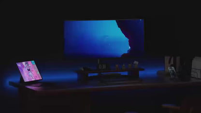 RGB light bars running colour and music-reactive modes behind a desk setup